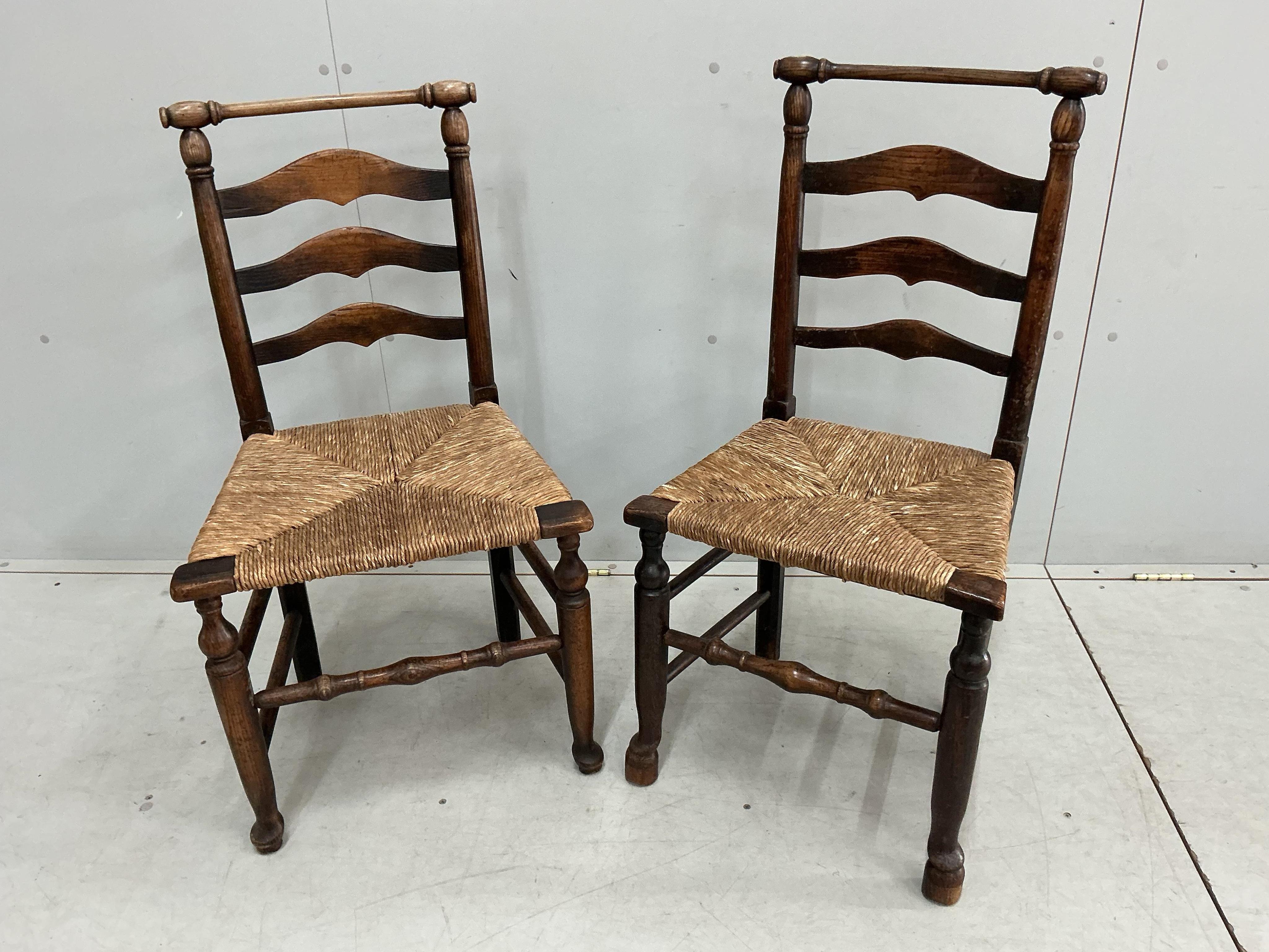 A harlequin set of eight 18th century ash ladderback rush seat dining chairs, two with arms